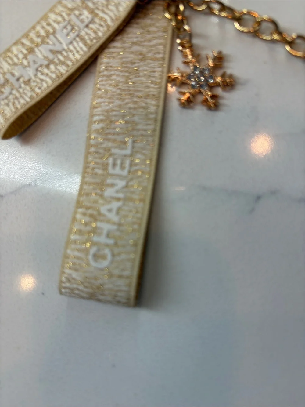 Beige and Gold Logo Strap Keychain with Charms
